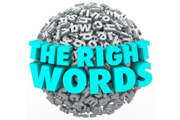 Silhouettes of people jumping on beach at sunset